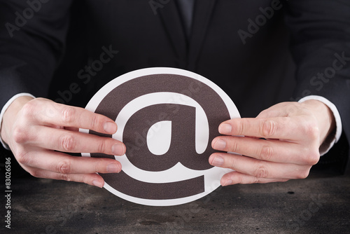 Man holding email icon in hands