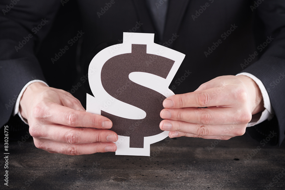 Man holding dollar icon in hands