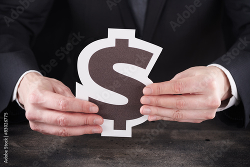 Obraz na płótnie Man holding dollar icon in hands w salonie