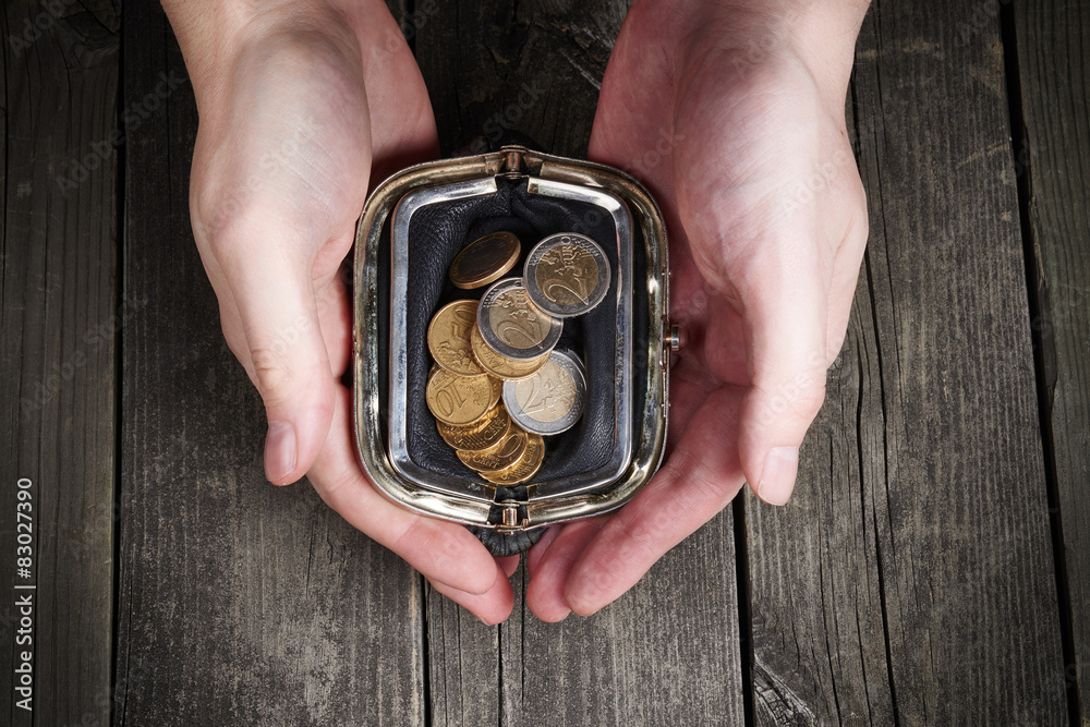 Hands holding money purse