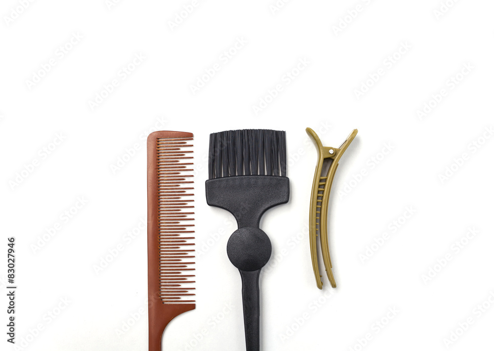 Comb brush and hairpin on white background 