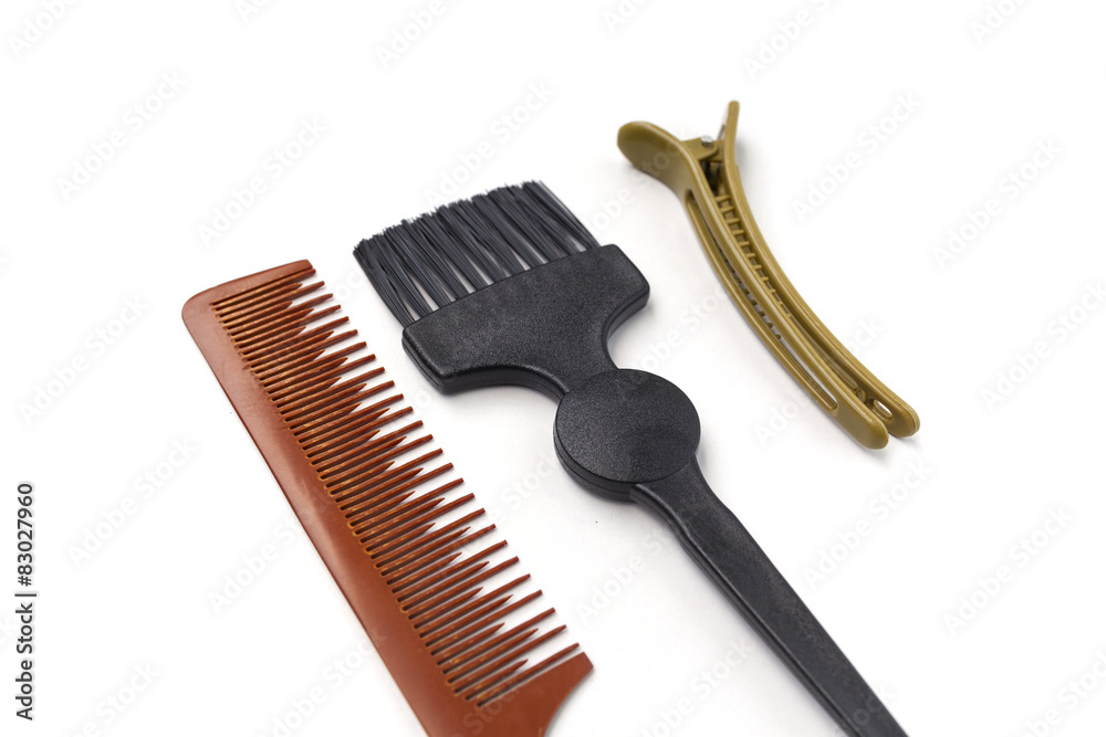 Comb brush and hairpin on white background horizontal Comb brush and hairpin on white background horizontal
