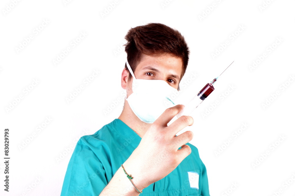 Studio shot of a young man with medical clothes Studio shot of a young man with medical clothes