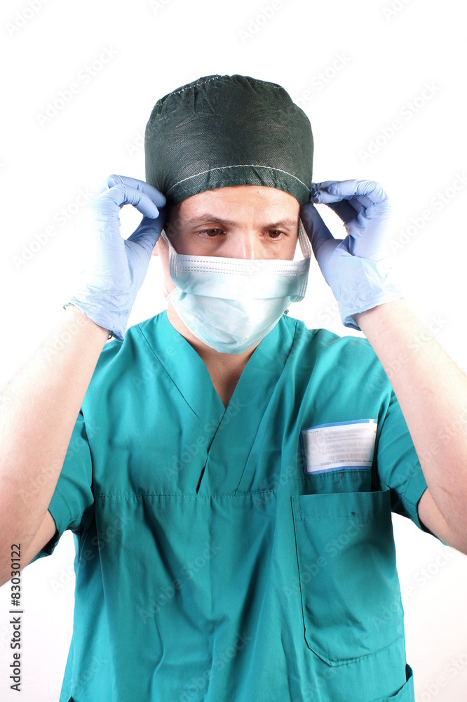 Studio shot of a young man with medical clothes Studio shot of a young man with medical clothes