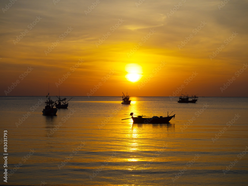 the tropical sea with coloful sunrise on the sky