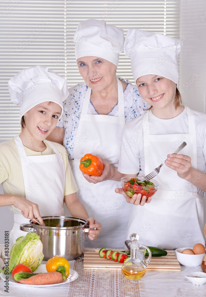 grandparents with two boys are preparing dinner grandparents with two boys are preparing dinner