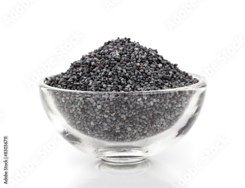 poppy seeds in a glass bowl isolated on white background