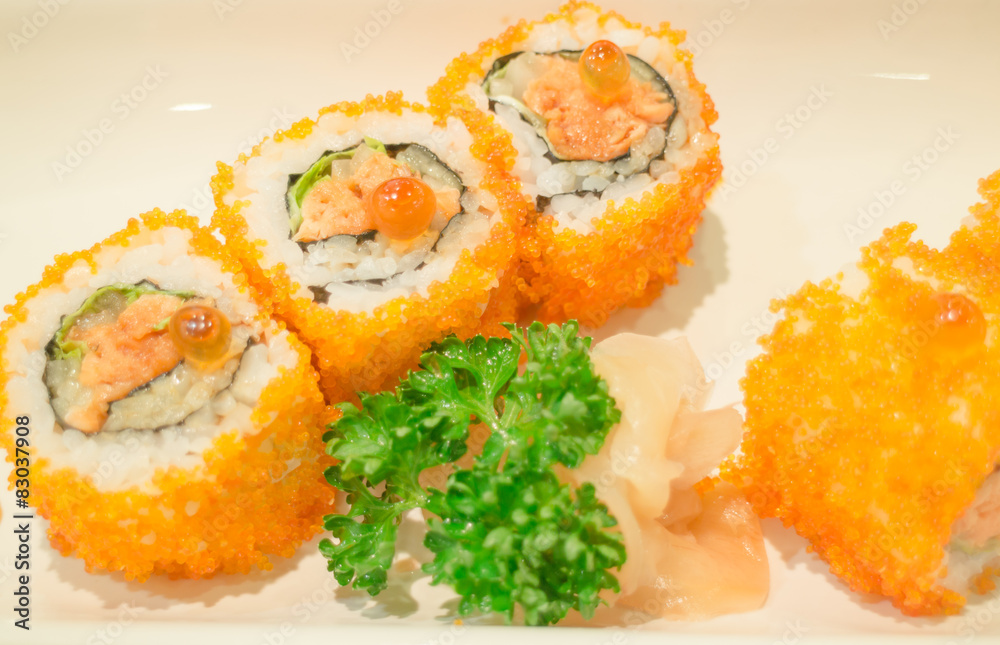 Smoked salmon sushi roll on plate Smoked salmon sushi roll on plate