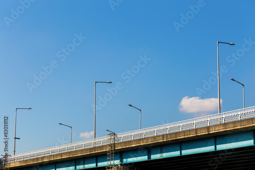 Bridge over water with lamp pole