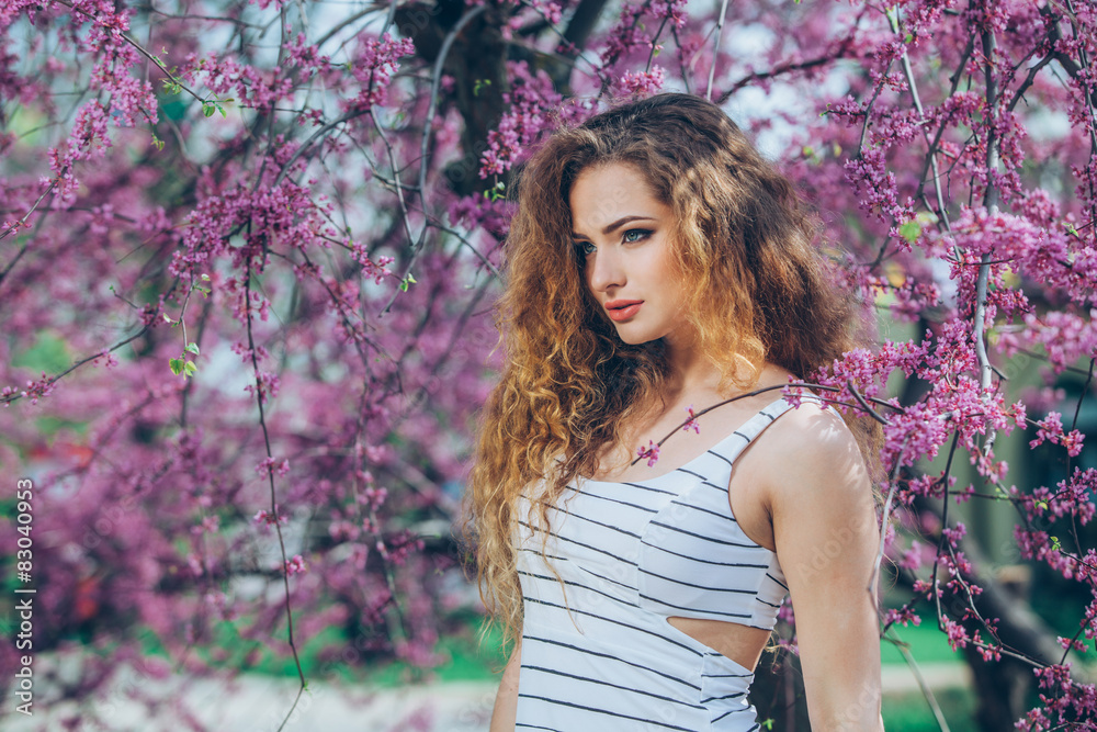 Beautiful young woman with gorgeous curly fair outdoors Beautiful young woman with gorgeous curly fair outdoors
