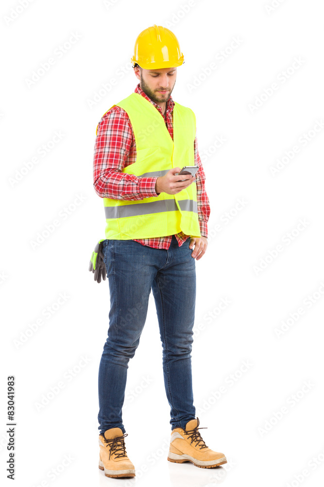 Construction Worker Sending a Text Message Construction Worker Sending a Text Message