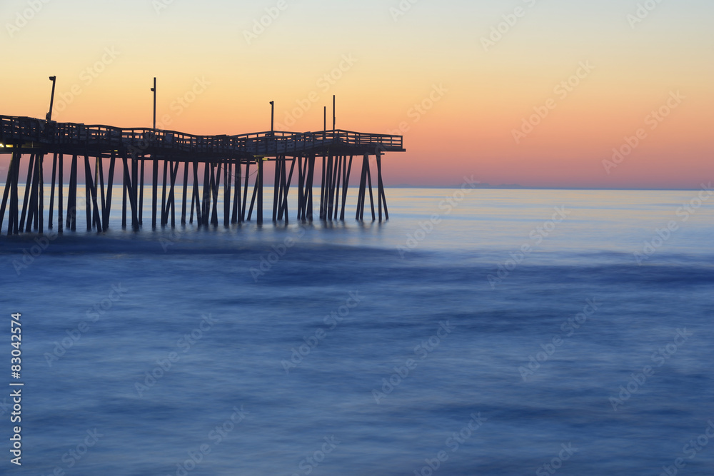 Fishing Pier and Smooth Ocean at Sunrise