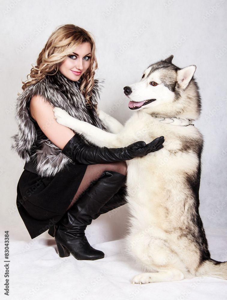 Beautiful young woman with a husky dog Beautiful young woman with a husky dog