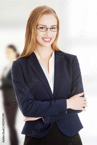 Young cheerful smiling business woman.
