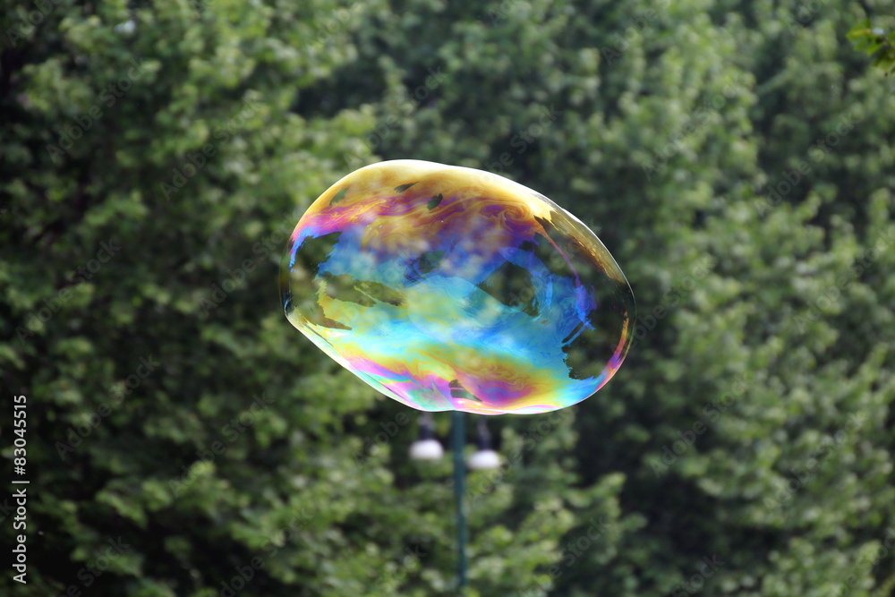 Giant soap bubbles created with ropes and sticks in a park Giant soap bubbles created with ropes and sticks in a park