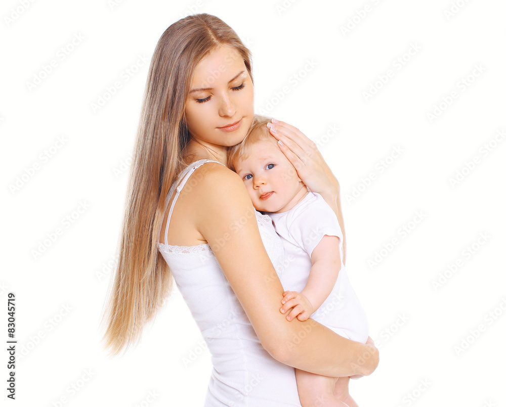 Happiness mother! Beautiful young loving mom hugs her cute baby Happiness mother! Beautiful young loving mom hugs her cute baby