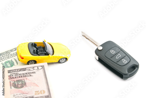 keys, notes and yellow car on white