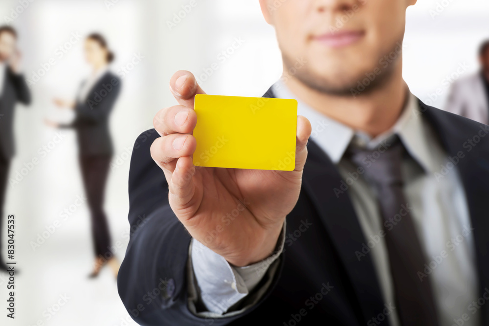 Businessman showing his personal card.