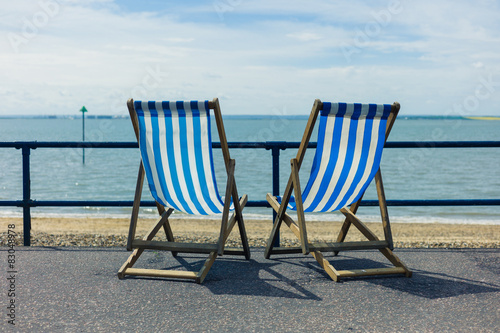Two deck chairs by the seaside