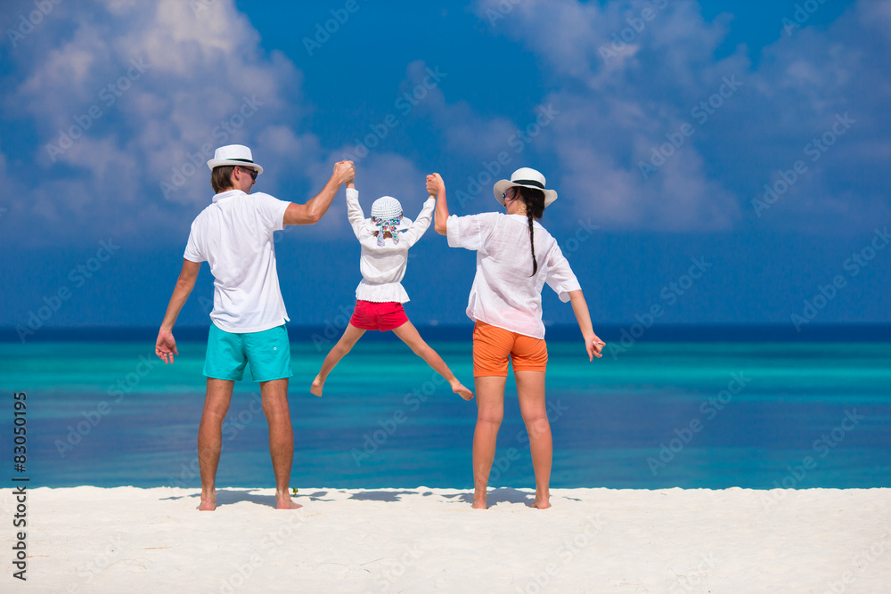 Young family on white beach during summer vacation Young family on white beach during summer vacation