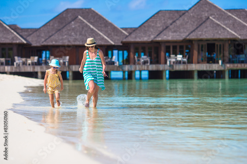 Mother and daughter enjoying time at tropical beach © travnikovstudio