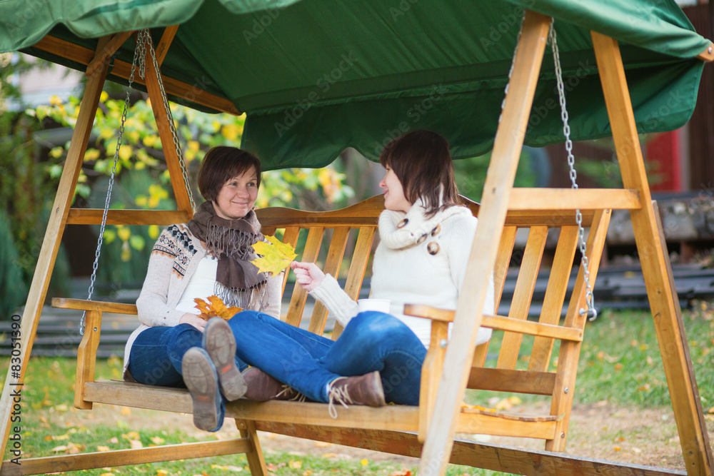Mother and daughter having on a fall day Mother and daughter having on a fall day