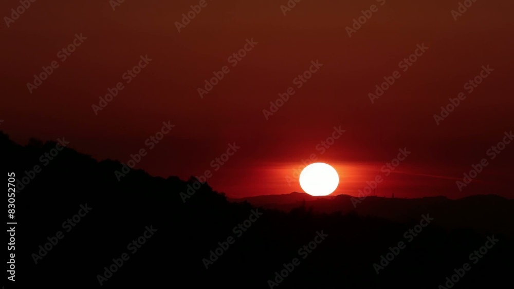 the red sun behind the mountains the red sun behind the mountains
