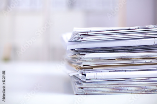 Big stack of papers ,documents on the desk photo