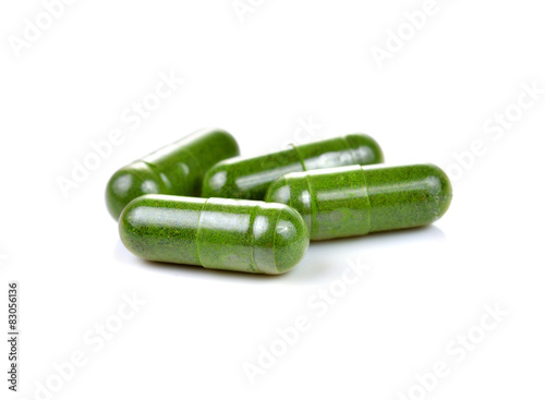 Moringa capsule pills on white background