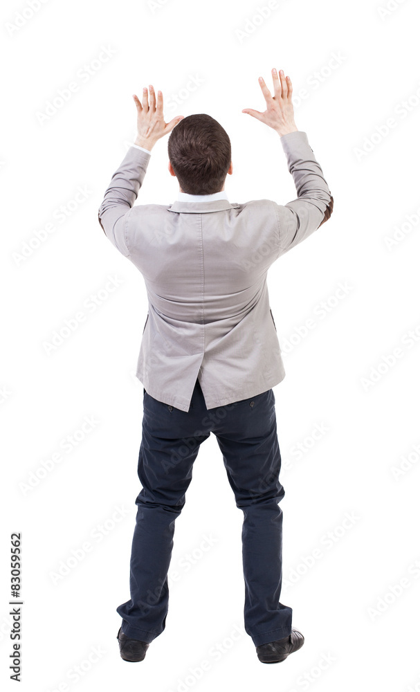 Businessman defends his hands on top of something. Businessman defends his hands on top of something.