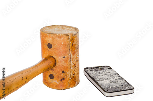 A broken smartphone and leather hammer on white background.