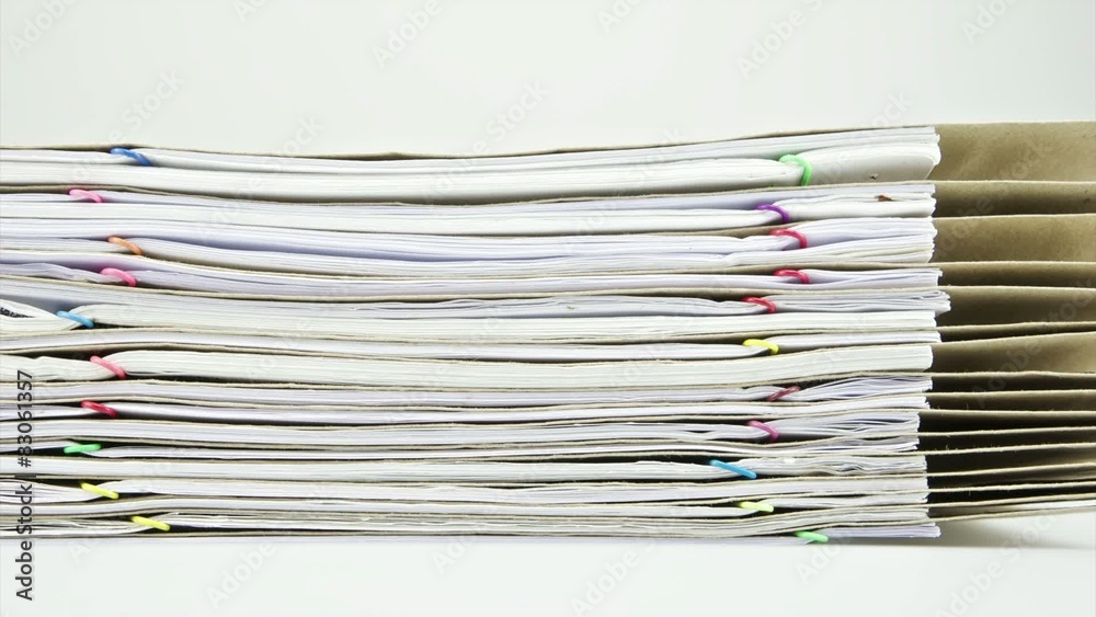 Stack paper report and envelope on table time lapse Stack paper report and envelope on table time lapse