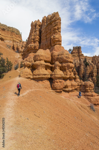 A Man and Woman explore the Rock Formations of Red Canyon Utah