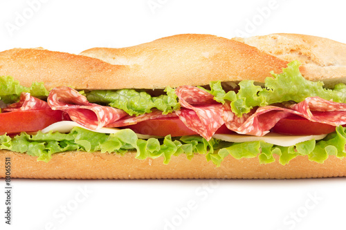 sandwich with salami, cheese, tomato and lettuce