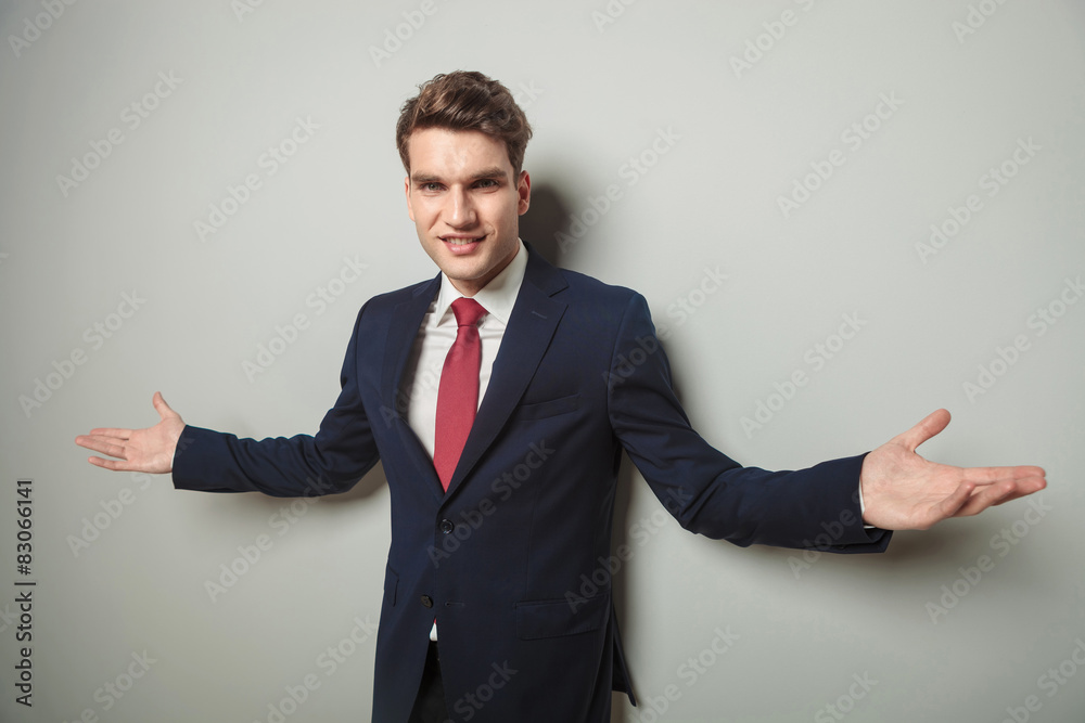 Happy young business man welcoming you Happy young business man welcoming you