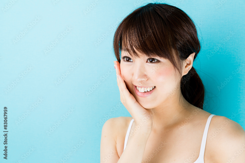 attractive asian woman beauty image on blue background attractive asian woman beauty image on blue background