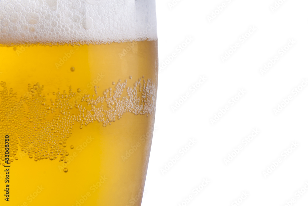 Golden cold beer with white froth. Golden cold beer with white froth.