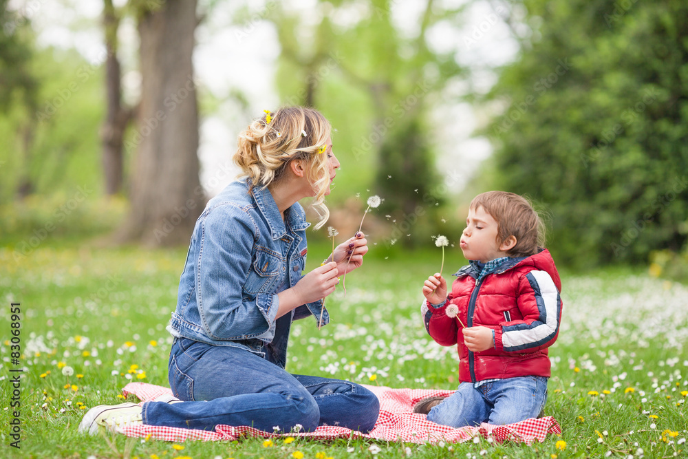 Beautiful family portrait of young mother and her cute son Beautiful family portrait of young mother and her cute son