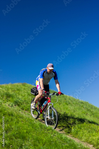 Cyclist Riding the Bike