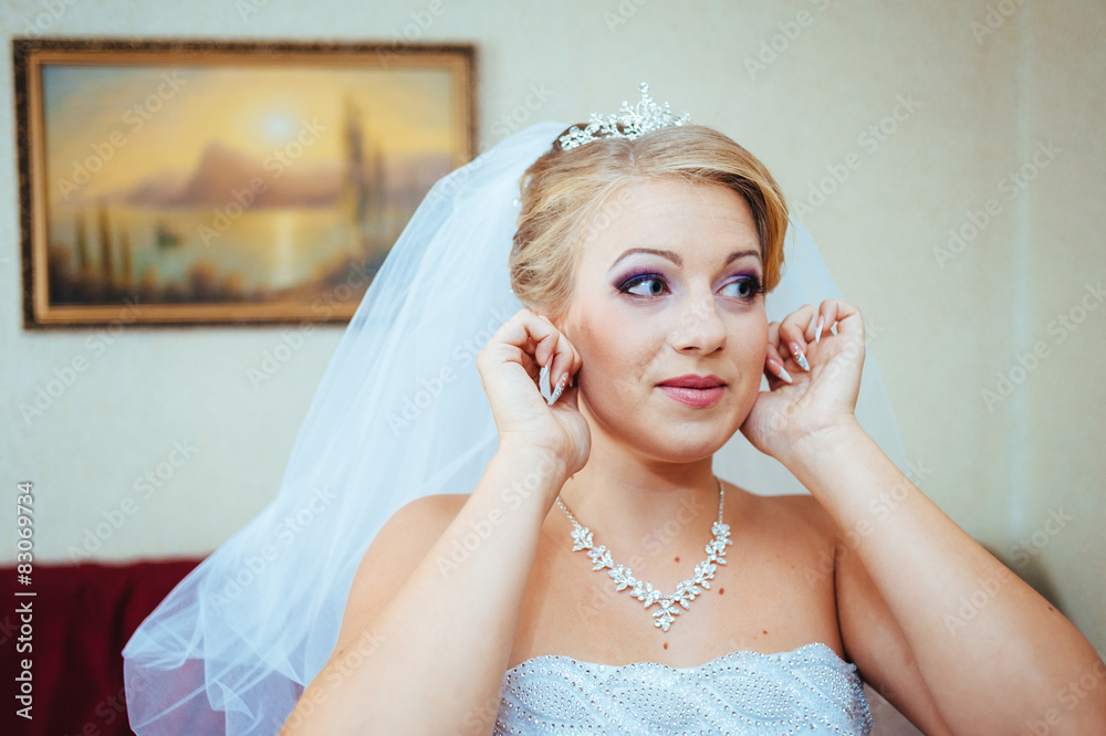 Beautiful caucasian bride getting ready for the wedding ceremony Beautiful caucasian bride getting ready for the wedding ceremony