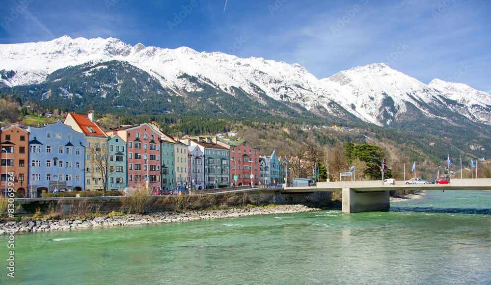 Historic architecture and snow capped mountains in Innsbruck, Au