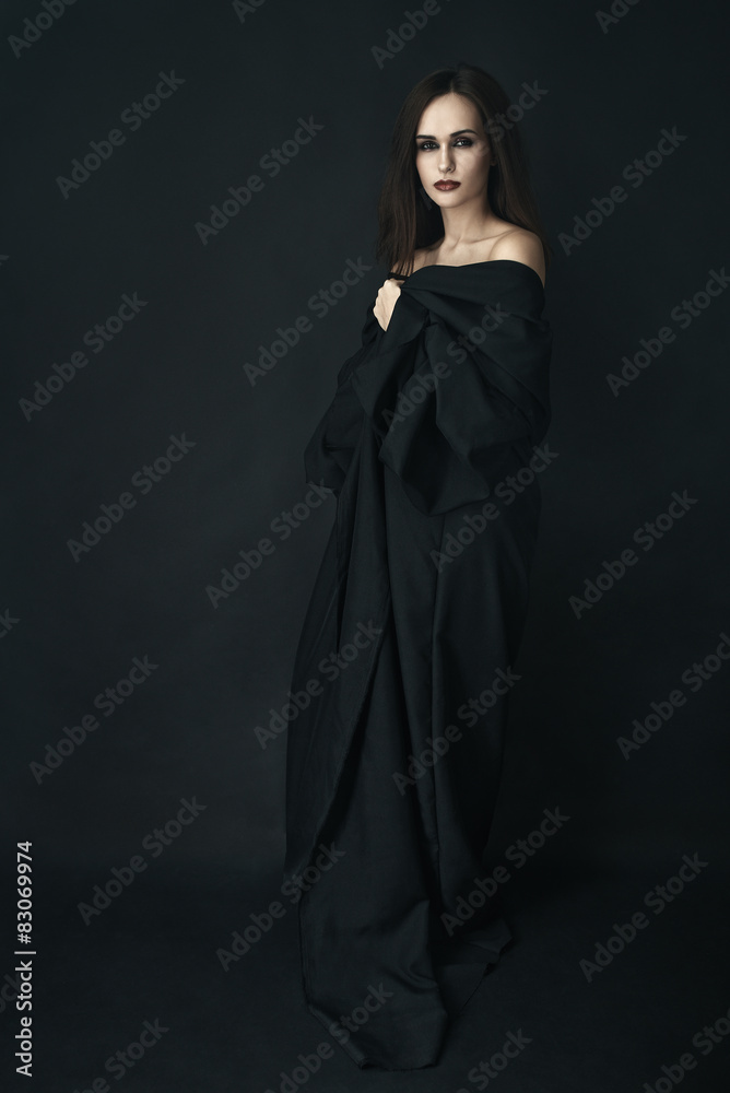 girl in  black dress on a dark background