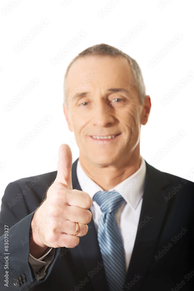 Mature businessman gesturing ok sign