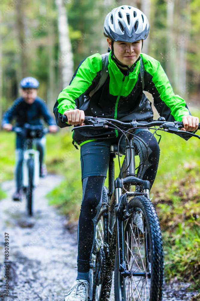 Healthy lifestyle - teenage girl and boy biking Healthy lifestyle - teenage girl and boy biking