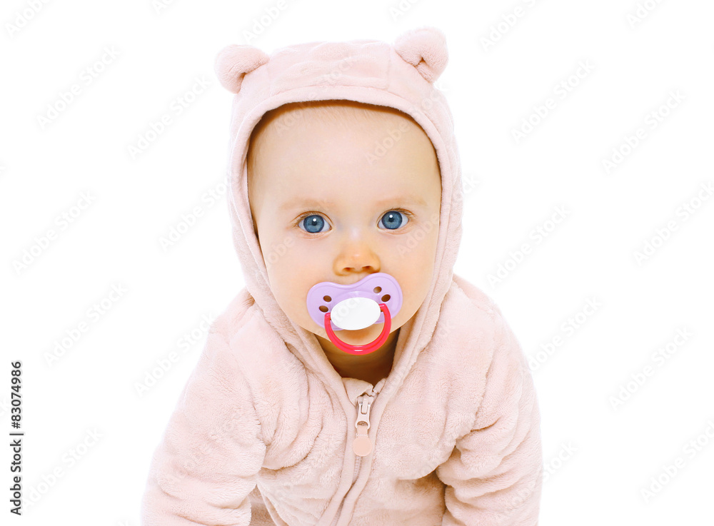 Closeup portrait of sweet baby with pacifier on a white backgrou Closeup portrait of sweet baby with pacifier on a white backgrou