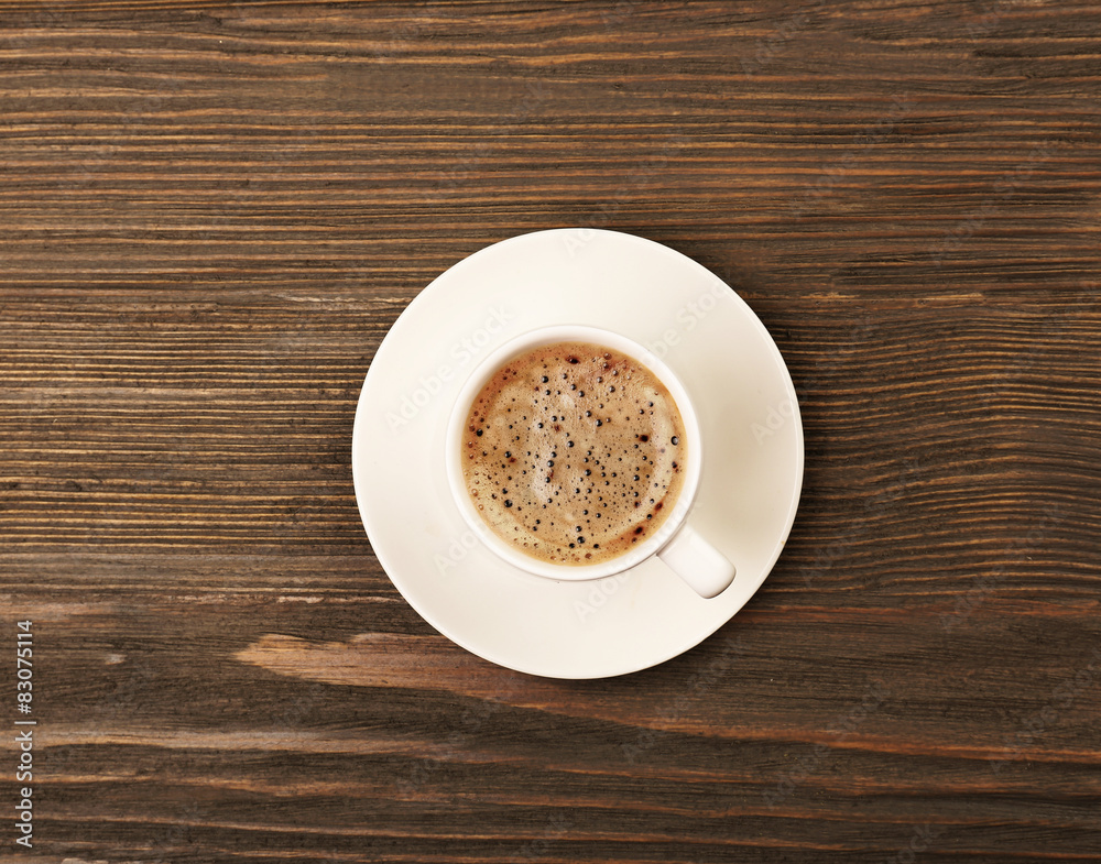 Cup of coffee on wooden table, top view Cup of coffee on wooden table, top view