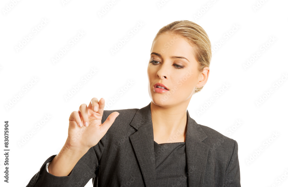 Woman pressing an abstract button Woman pressing an abstract button