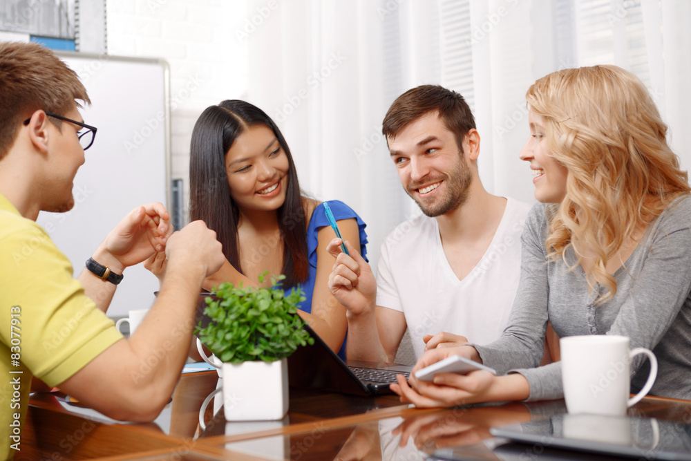 Smart handsome app developer with his team Smart handsome app developer with his team