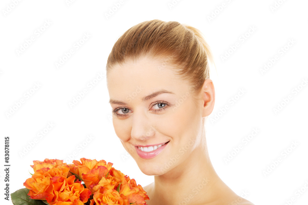Fototapeta premium Smiling woman with fresh roses.