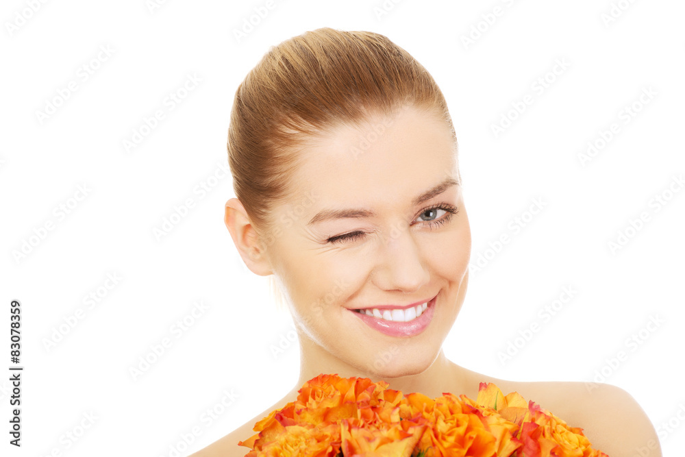 Smiling woman with fresh roses.